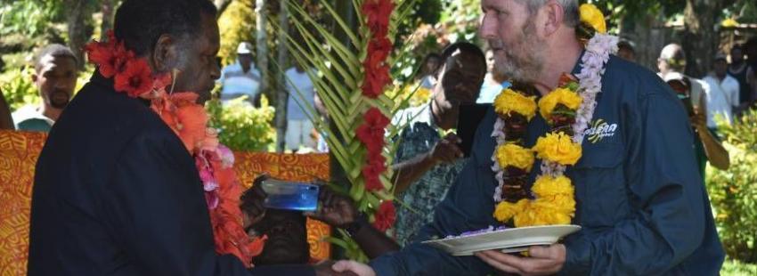 Peter Lynch (right) officially handling the keys for Talise Hydro Stage 2 to Vanuatu’s Minister of Planning and Climate Change Adaptation, Ham Lini.