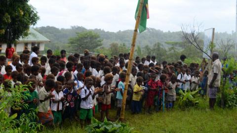 Itiki school children and teachers welcome delegates to launch of solar system